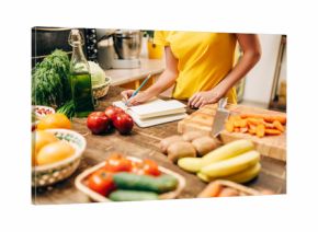 Female person cooking on the kitchen, bio food