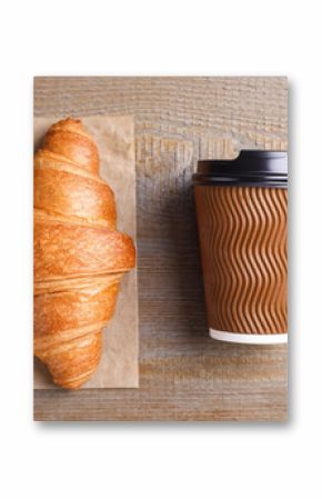 Tasty croissant and drink on wooden table, flat lay