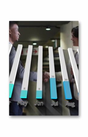 Business professionals wearing suits shaking hands in office corridor, with 3D bar chart overlay