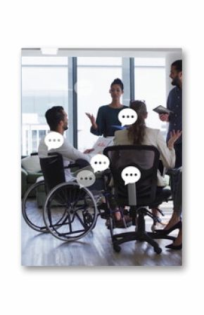 Holding meeting coworkers wearing business attire exchanging ideas in office, with wheelchair