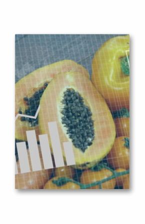 Displaying halved papaya with carrots and cherry tomatoes on grid surface, with data overlays