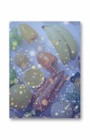 Displaying produce on kitchen countertop featuring grapes and granola bowl with snowflakes