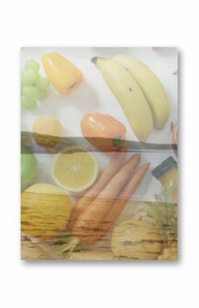 Displaying produce spread with bananas, grapes and peppers on white table, with wooden pier overlay