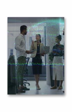 Collaborating four professionals reviewing data overlay on laptop beside desks in open-plan office
