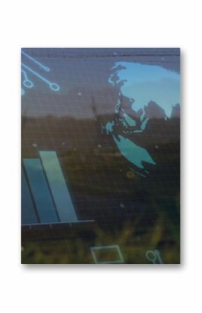 Projecting digital interface over grassland, showing globe, rising bar chart and circuit grid