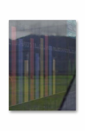 Displaying transparent digital dashboard covering field, with bar and line charts, numeric panels