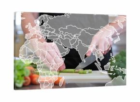 Slicing adult hands wearing dark apron chopping asparagus on cutting board, with world map overlay