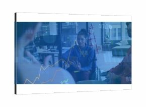Presenting business casual woman in wheelchair showing charts in glass office with tablet overlay