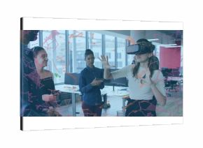 Demonstrating colleague wearing short-sleeve top gesturing at office, with VR headset, copy space