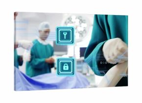 Pulling on glove scrubbed surgeon preparing surgery in OR, with digital key lock icons, copy space
