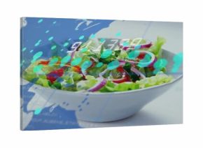 Displaying white bowl holding salad on studio tabletop, with blue map overlay and numeric display