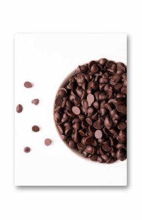 Directly above view of fresh chocolate chips in bowl over white background
