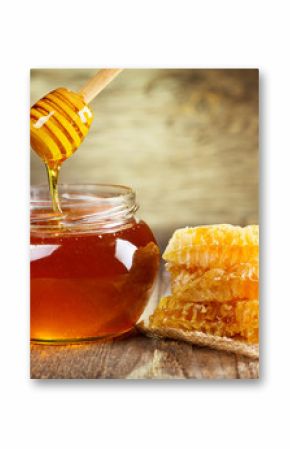 jar of honey with honeycomb
