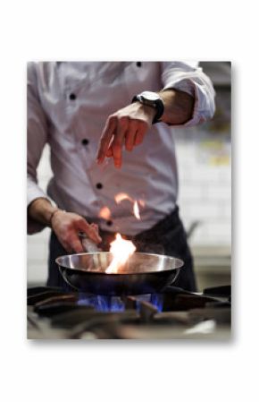 A man cooks cooking deep fryers in a kitchen fire.