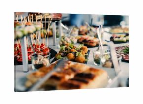 Table full of tasty food beautifully decorated.
