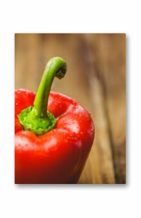 Fresh red pepper on wooden table