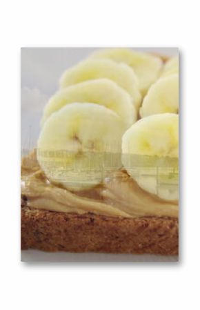Featuring peanut butter and banana slices topping toast on pale plate by marina window, copy space