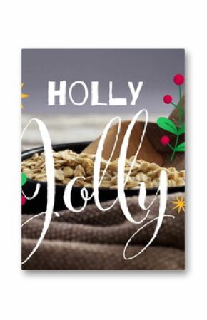Showing black bowl of oats holding wooden scoop on cloth tabletop, with holly sprigs, text overlay