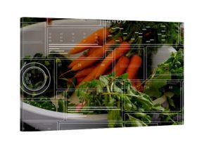 Displaying white bowl holding bright orange carrots on wooden countertop, with digital panels