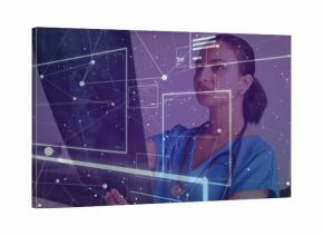 Holding X-ray tablet, Indian doctor wearing stethoscope studying data on transparent display in lab