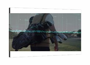 Walking Chinese golfer carrying golf bag with clubs across dawn golf fairway, floating chart line