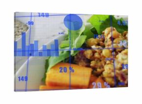 Close-up salad bowl showing lettuce chickpeas sweet potato lemon on table, with blue data overlays