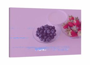 Presenting three glass bowls on kitchen countertop, with blueberries, strawberries, and yogurt