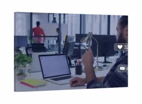 Working bearded man plaid shirt holding phone typing laptop at office with social icons, copy space