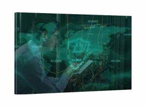 Inspecting Korean IT tech wearing light shirt tie checking tablet in data center with patch cables