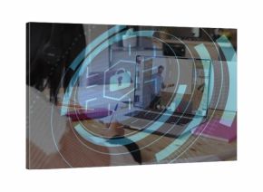 Writing person in striped sweater noting at wooden table with laptop, pink notebook, padlock HUD