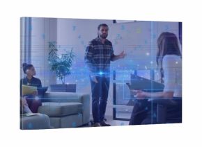 Gesturing presenter in plaid shirt and jeans pointing at whiteboard in lounge with digital overlay