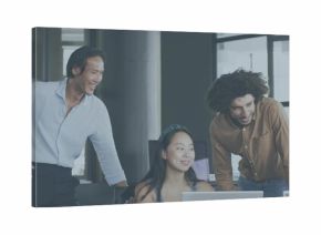 Reviewing project, Asian woman wearing headband collaborating with coworkers at office with laptops