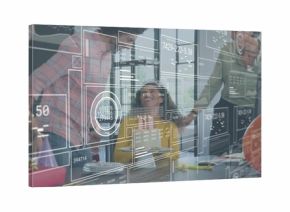 Celebrating coworker in yellow top, glasses at conference table with gifts, glass overlays
