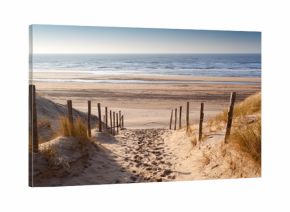 sand path to North sea at sunset