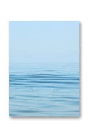 Calm sea surface. Seascape in early morning hours under clear skies.