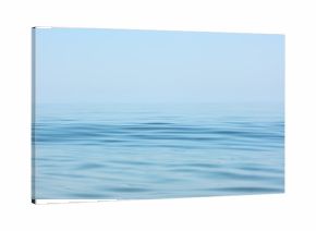 Calm sea surface. Seascape in early morning hours under clear skies.