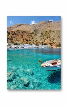 Small motorboat at clear water bay of Loutro town on Crete island, Greece