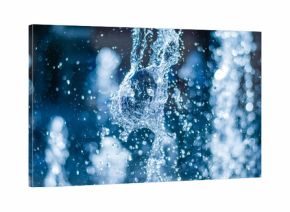 The gush of water of a fountain. Splash of water in the fountain, abstract image