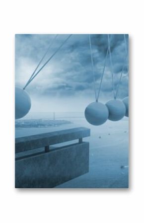 Newtons cradle above coastline