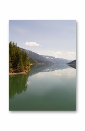 Trees on mountain range by river