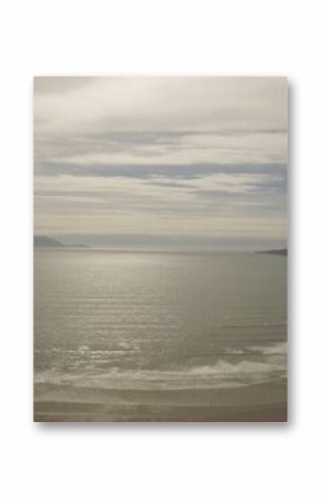 Seascape against cloudy sky