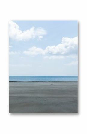 Wide wet sand shoreline is stretching in flat design, with calm sea, cloudy sky, rocky outcroppings