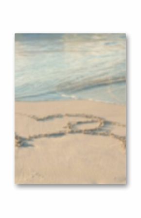 Heart shape drawing on sand at beach
