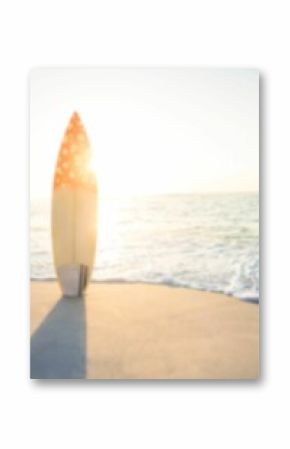 Surfboard on beach against sunny sky