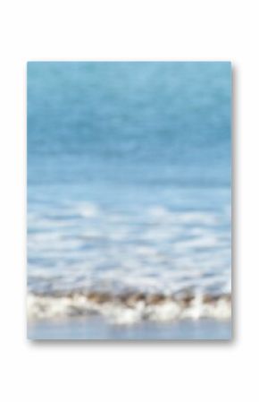 Shallow breaking ocean wave is washing onto foamy wet sand in soft focus flat illustration