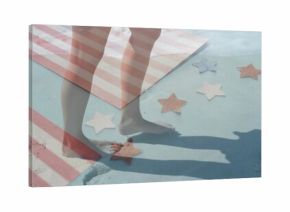 Stepping bare feet on sandy painted surface at beach edge, with striped towel, star-shaped cutouts