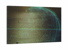 Reflecting sunlit ocean surface creating shimmering path at sea, showing waveform and particle arc