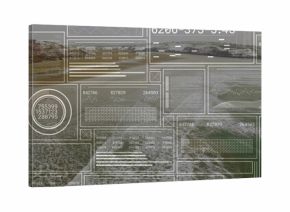 Displaying coastal shore showing rocky cliffs beach surf from drone with HUD panels and gauges