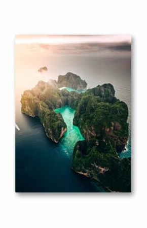 Aerial view of a forested green rocky island with a sandy beach in Thailand, Krabi, Phi Phi Island