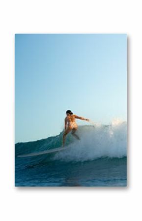 Person surfing in the ocean on a sunny day